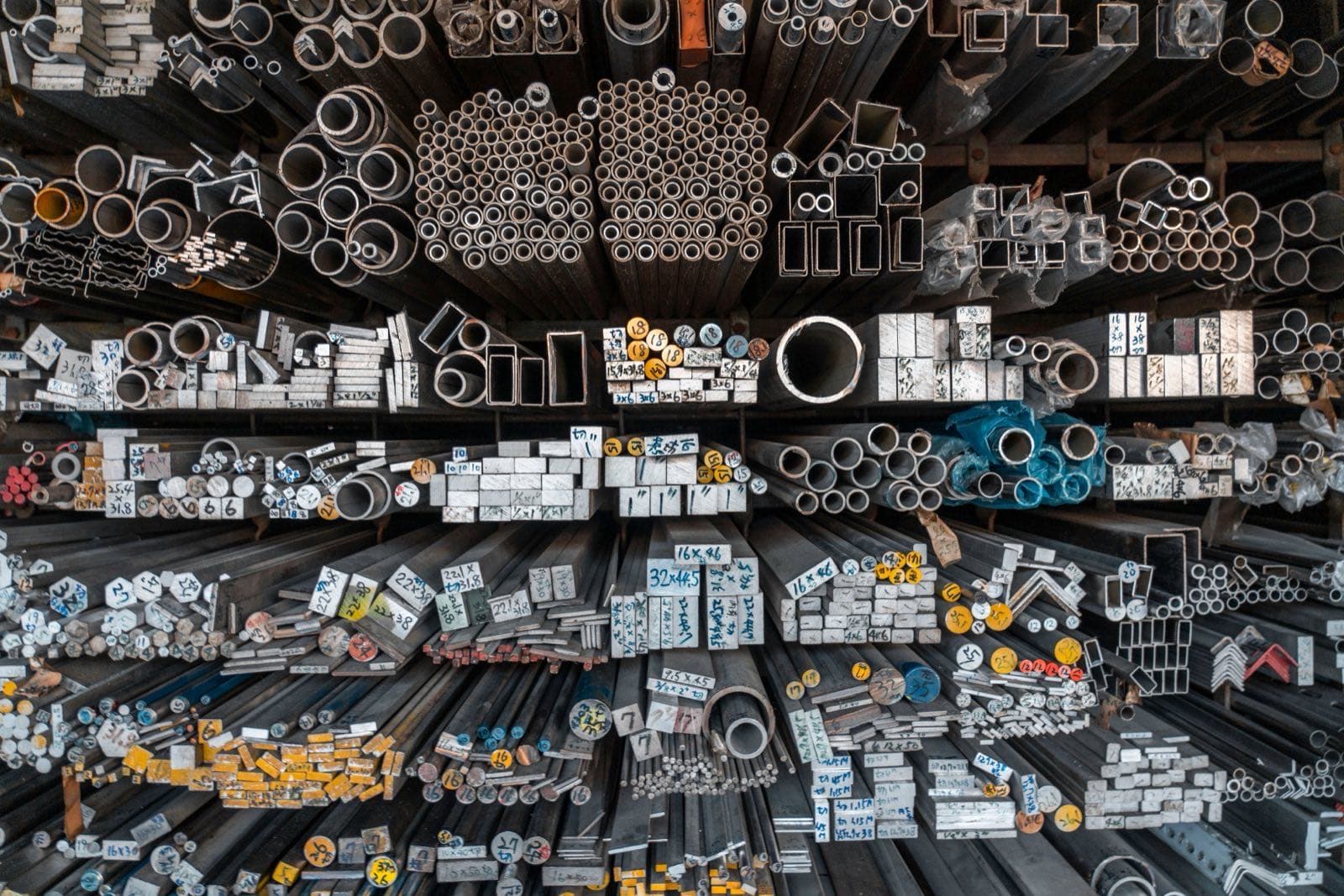 Copper pipes and tubing stacked on display, illustrating goods affected by the copper tariff