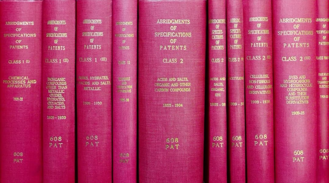 A row of bound reference volumes on a shelf, representing the layered structure of the Harmonized Tariff Schedule