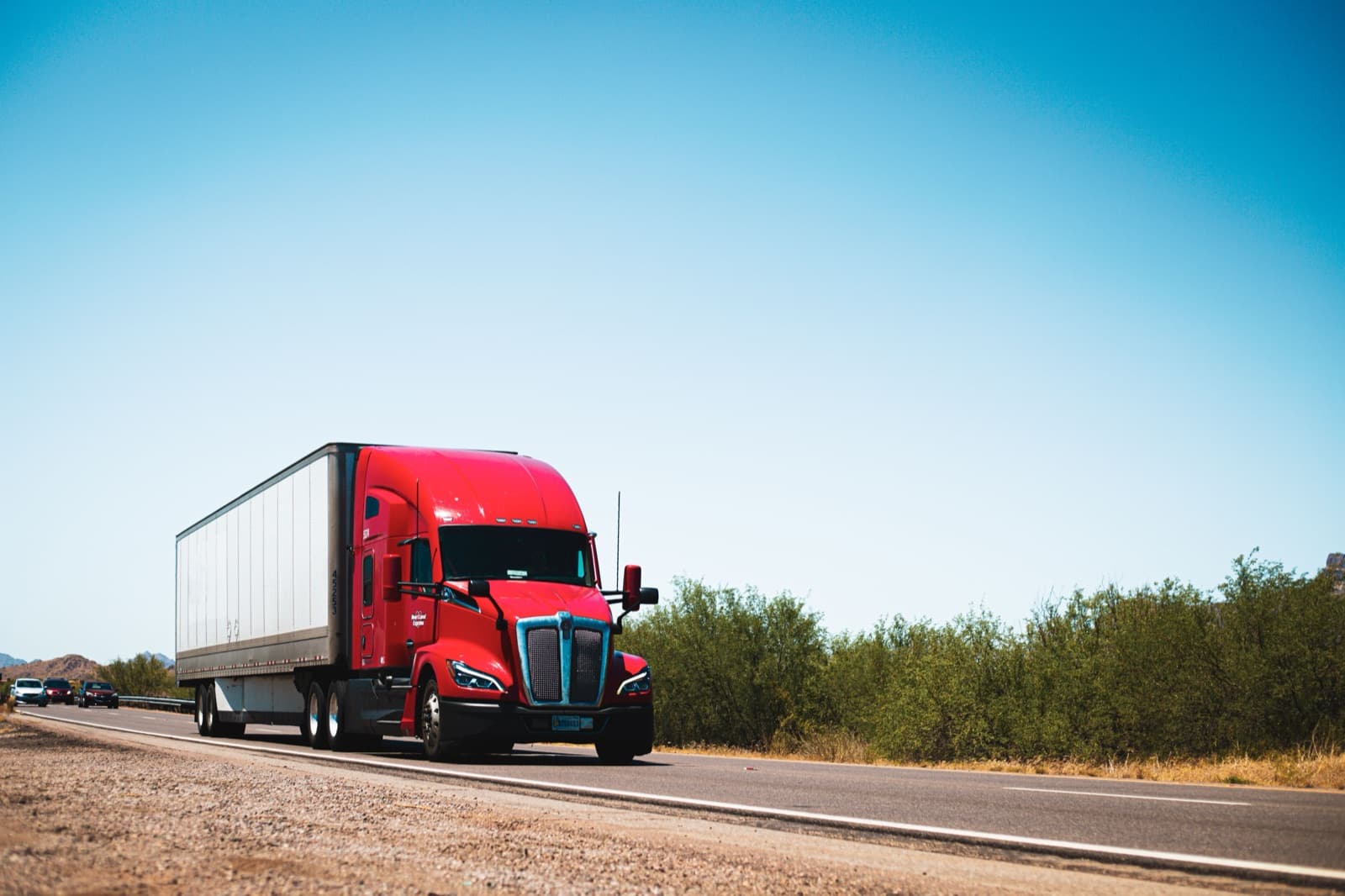 Freight truck on a highway, representing cross-border USMCA trucking between the US, Canada and Mexico